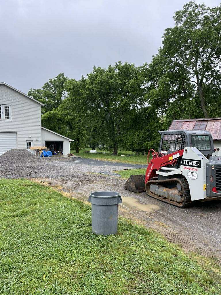 Placeholder before photo for drainage and parking lot install — replace with your own project photo.